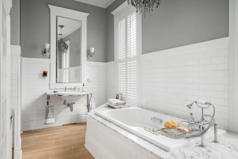 Serene and elegant bathroom with a soaking tub and marble accents.