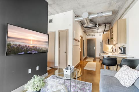 Modern apartment interior with a cozy living space and kitchen.