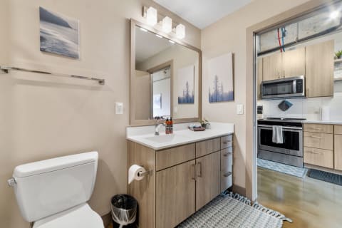 Stylish bathroom with a sink vanity and minimalist design elements.