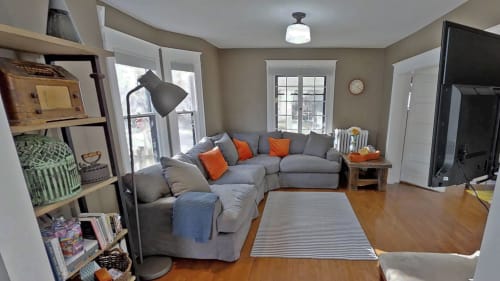 Sink into the plush sectional and unwind in your bright, airy living space with warm hardwood floors and cheerful pops of color.
