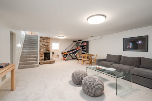 Your spacious game room combines comfort and fun with a cozy seating area, basketball hoop, and dining space for memorable evenings.