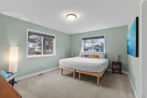 Drift off peacefully in your serene bedroom with soft sage walls and cozy lighting creating the perfect restful retreat.