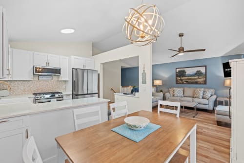 Unwind in your bright open-plan space where the modern kitchen flows seamlessly into your cozy living area, perfect for gathering.