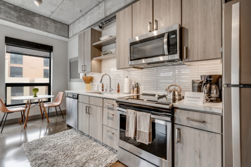 Your modern kitchen features sleek wood cabinets, stainless steel appliances, and everything you need to create memorable meals during your stay.