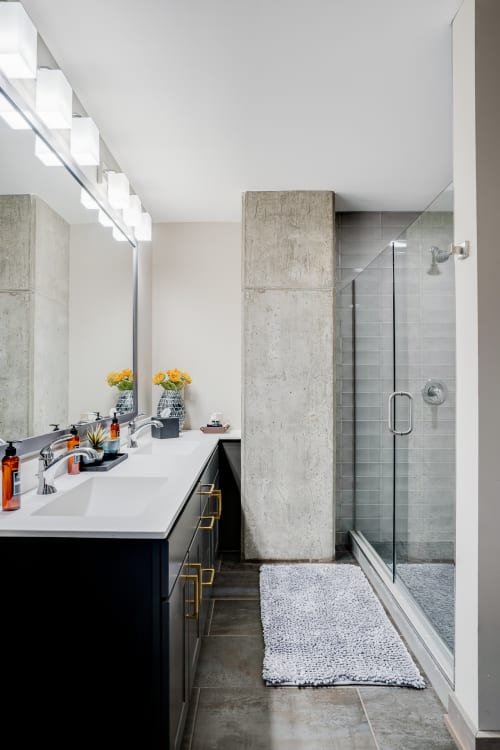 Soak away your stress in this sleek spa-style bathroom featuring a luxurious walk-in shower and modern vanity.