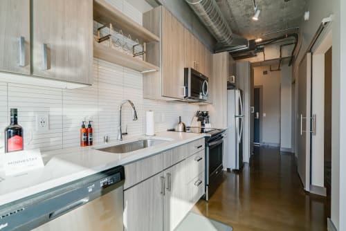 Your modern kitchen features sleek appliances, quartz counters, and contemporary finishes for effortless meal prep.