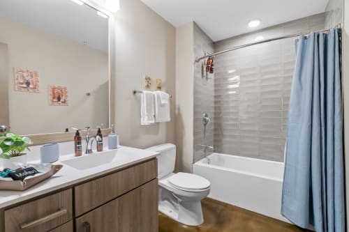 Refresh in your stylish bathroom with modern finishes, soaking tub, and thoughtful amenities ready for your stay.