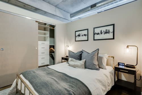 Unwind in your modern loft bedroom with exposed ceiling details, soft linens, and smart storage solutions for the perfect urban retreat.