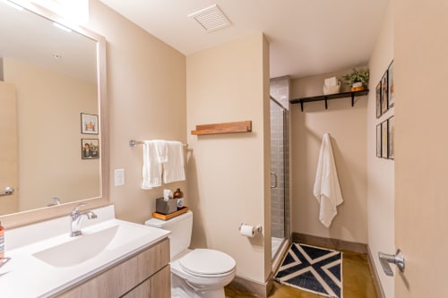 Step into your spa-like bathroom with modern fixtures, fluffy towels, and thoughtful touches that make freshening up a delight.