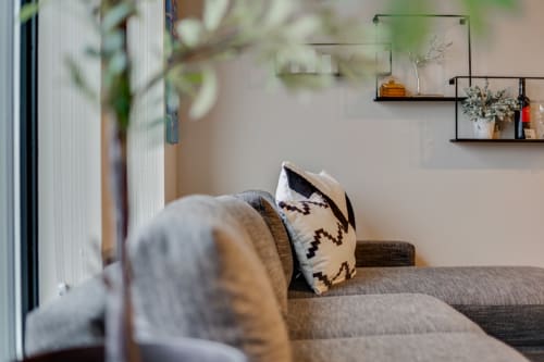 Sink into this plush sofa where soft textures and thoughtful details create your perfect relaxation spot.