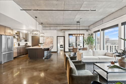 Unwind in this stunning open-concept space where modern design meets urban sophistication. Your living area flows seamlessly into a gourmet kitchen perfect for entertaining.