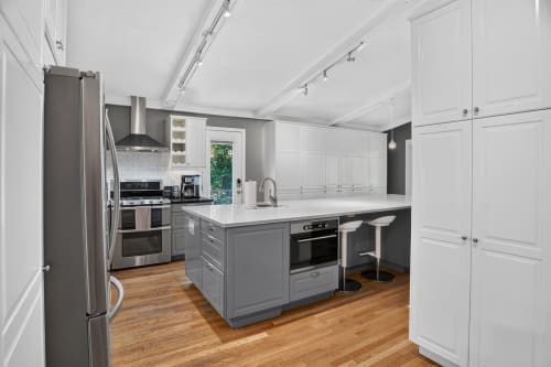 Step into your fully equipped chef's kitchen, complete with stainless steel appliances and a spacious island where you can prep meals or gather with loved ones.