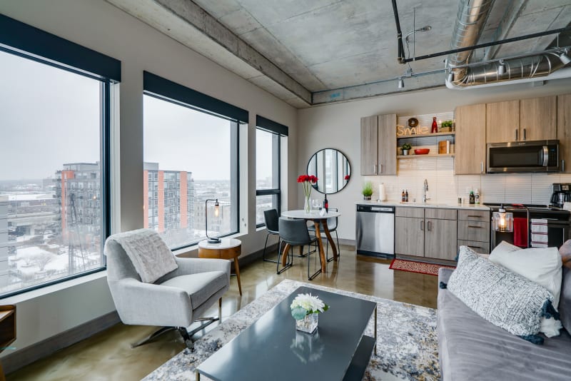 Settle into this modern loft with soaring concrete ceilings and stunning city views. You'll love the open concept design blending living and kitchen spaces perfectly.