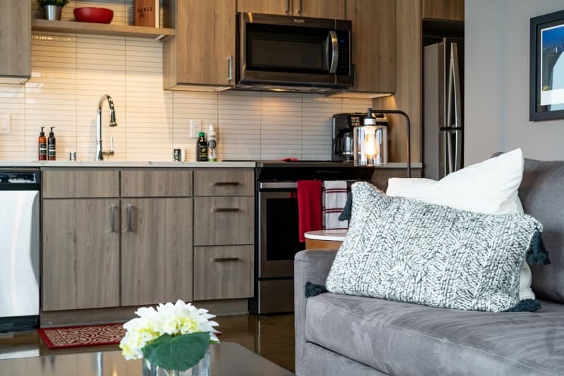 Unwind in your stylish open-concept space where the fully-equipped kitchen meets cozy living area, perfect for cooking and relaxing together.
