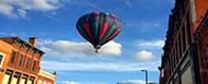 Hot air balloon over a city.