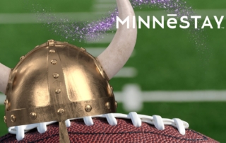 Viking helmet on a football on the field.