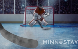 Person taking a shot on goal in a hockey arena in Minnesota